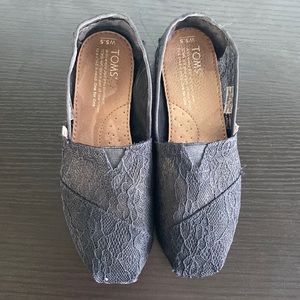 black lace slip on Toms